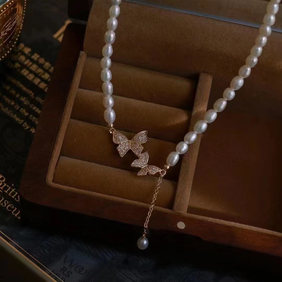 Picture of Zhuji freshwater pearl necklace necklace 5-6mm rice beads butterfly pendant 38 5cm length female clavicle chain wholesale