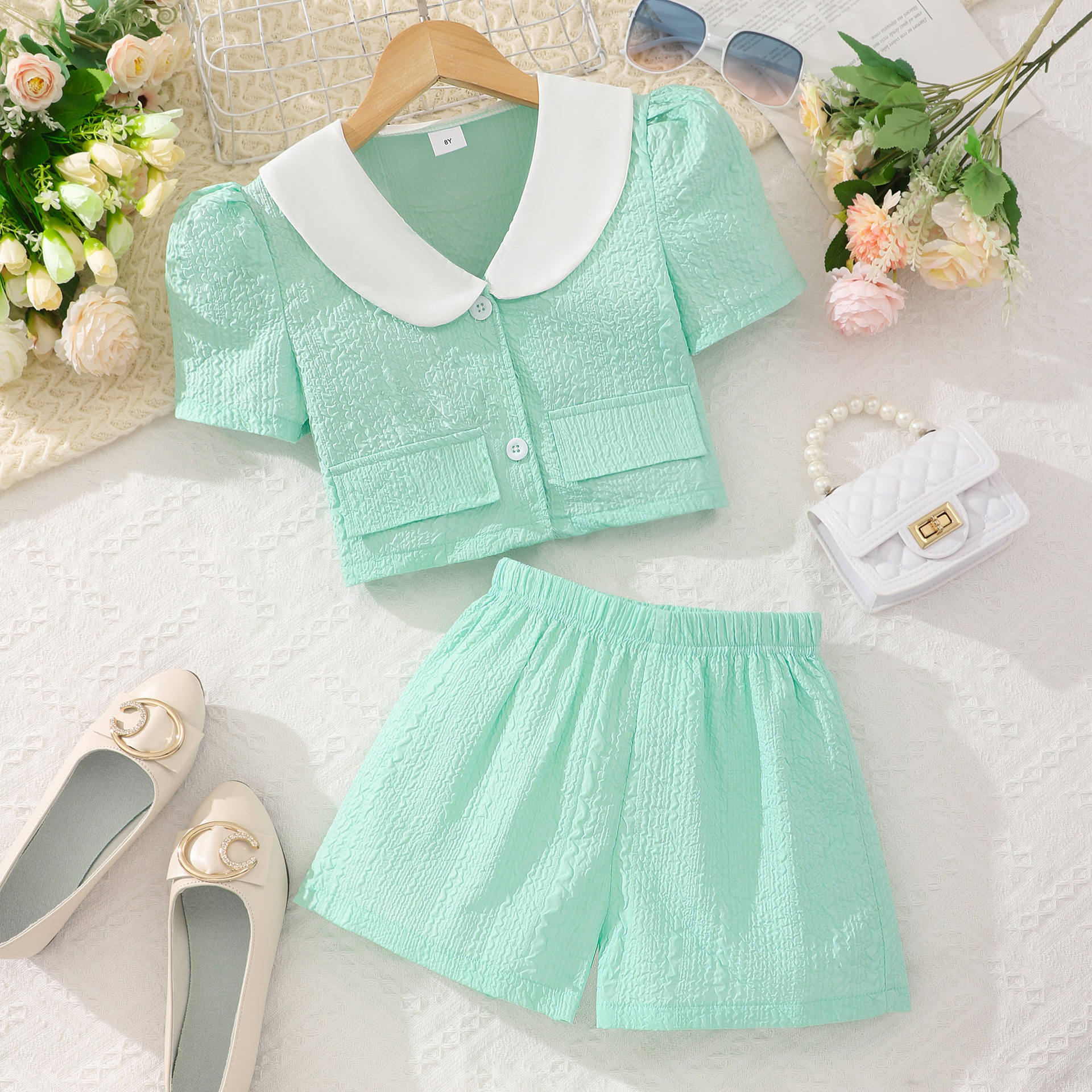 Medium and large children's short-sleeved Y-collar solid color embossed shorts suit
