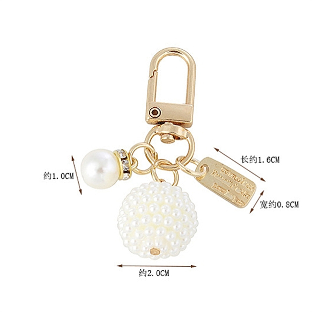 Picture of New Pearl Alloy Keychain Pendant Creative Pearl Hollow Love Accessories Bluetooth Headphone Box Bag Pendant