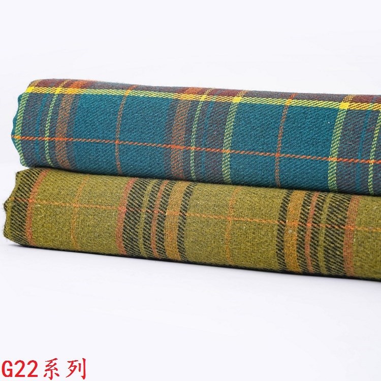 Picture of 140g Yarn-Dyed Plaid Woolen Fabric in Stock Wholesale 21S Yarn-Dyed Twill Brushed Plaid Shirt Fabric Ins Flannel