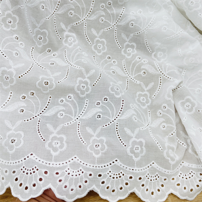 Factory wholesale white cotton hollow embroidery fabric bilateral cotton perforated garment skirt lace fabric