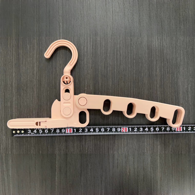 Picture of Folding clothes hanger thickened indoor multi-functional wall hanging travel plastic hanger wholesale business trip portable five-hole hanger