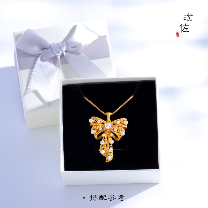 Picture of Long-standing antique gold imitation gold pearl lace large bow pendant necklace sweater chain clavicle chain women