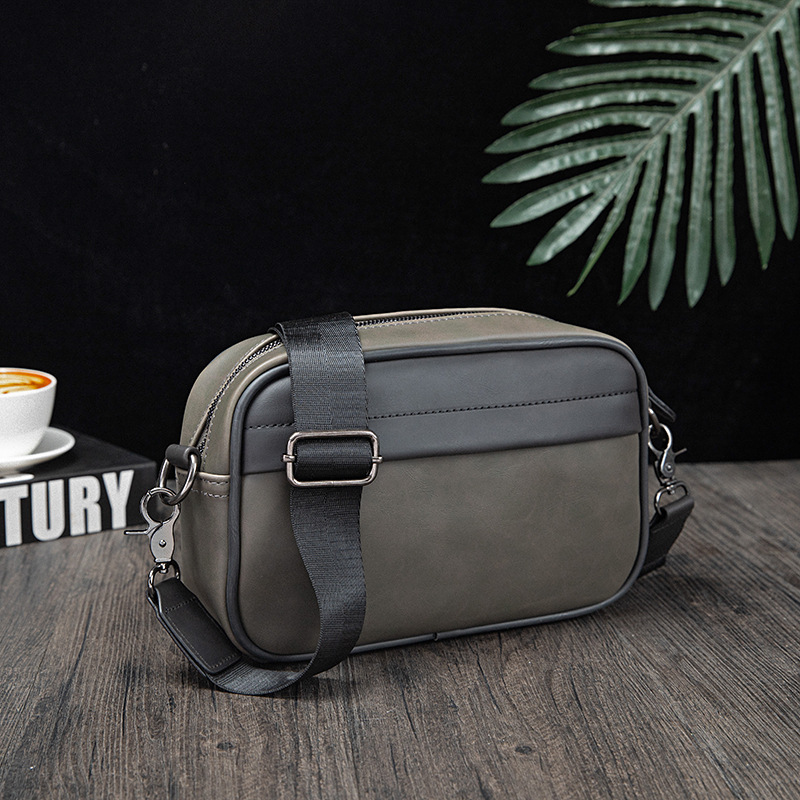 Picture of Korean fashion Men's messenger bag 2024 New retro solid color small backpack casual shoulder phone bag for men