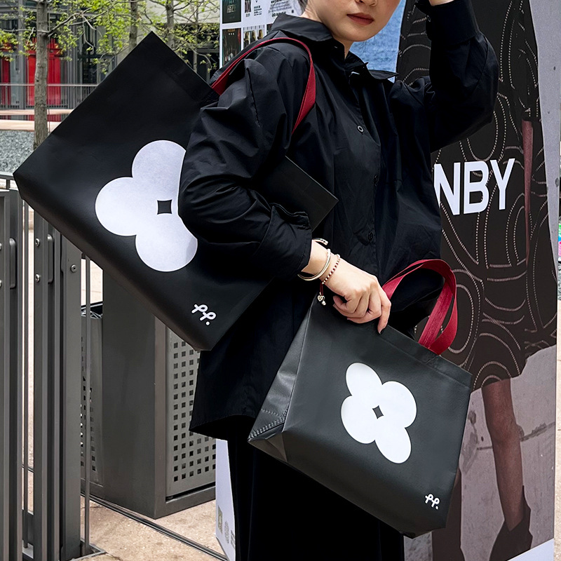 Non-woven handbag new material clothing store environmental protection waterproof women's clothing store clothes bag wholesale shopping packaging belt