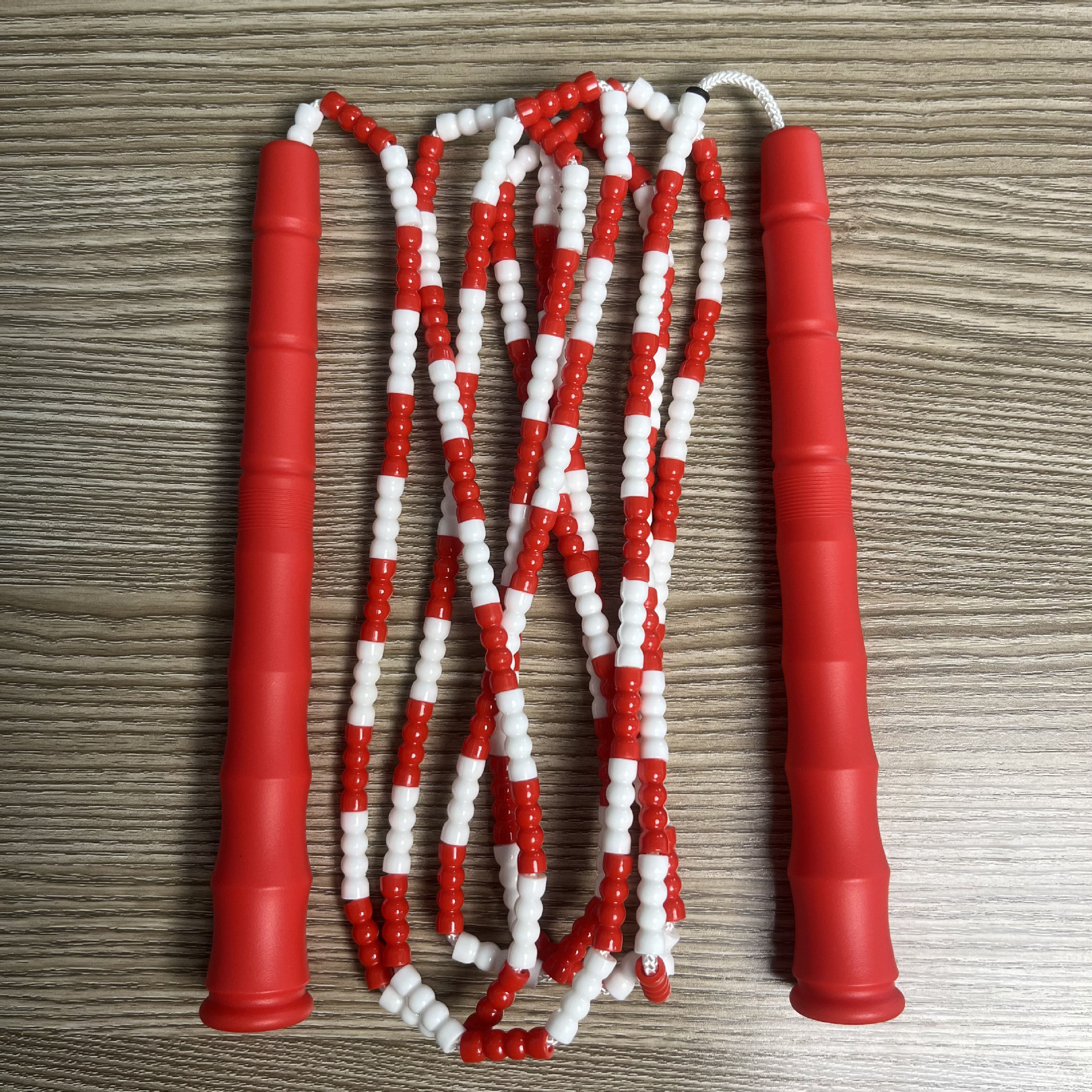 Picture of Manufacturer Wholesale Children's Fitness Sports Pattern Skipping Rope Kindergarten Competition Soft Bead Bamboo Skipping Rope for Primary School Students