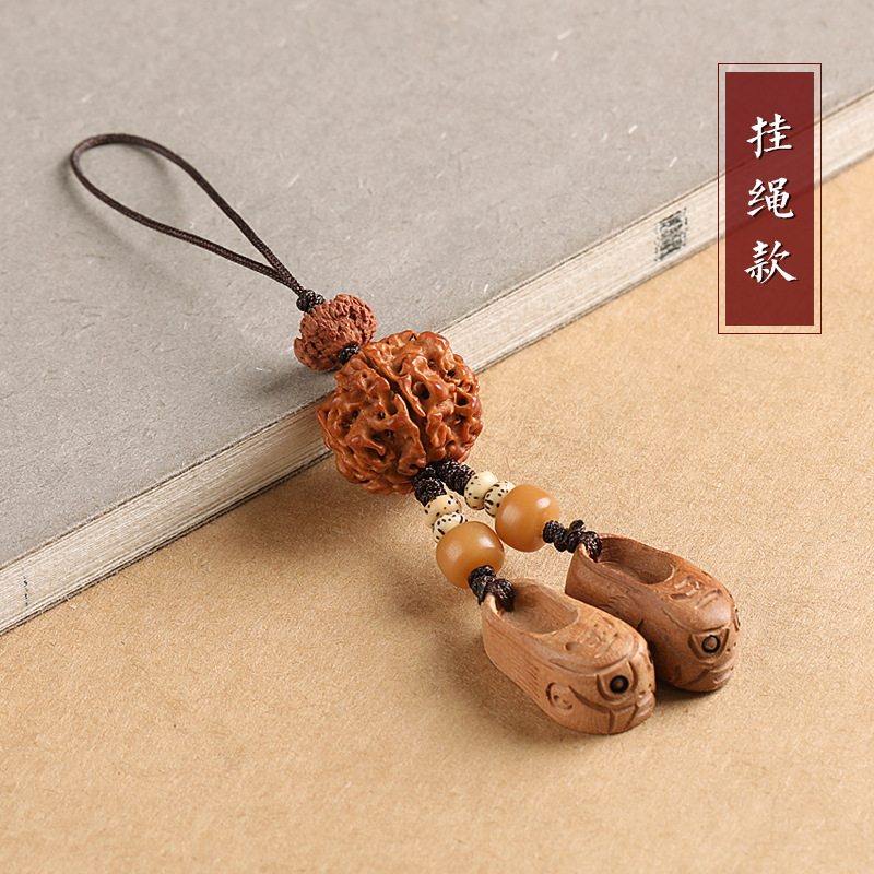 Peach Wood Tiger head shoes men's car keychain pendant hand safety personality creative decoration female X flat machine chain hanging hand.