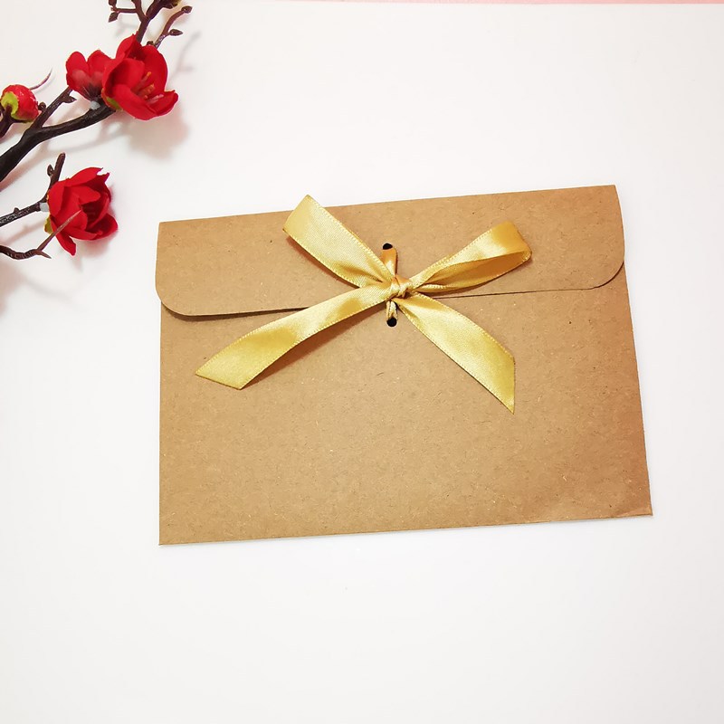 Picture of European envelope Kraft paper style vintage greeting card blessing card packaging bag creative bow CD bag wholesale