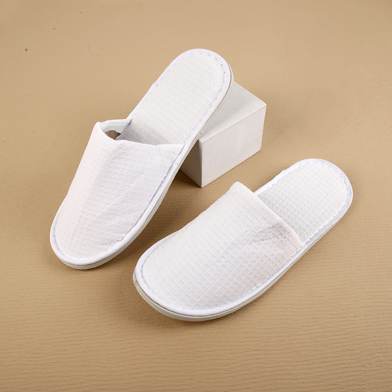Picture of Hotel and homestay disposable waffle slippers home hospitality travel thickened slippers can be wholesale ordered LOGO