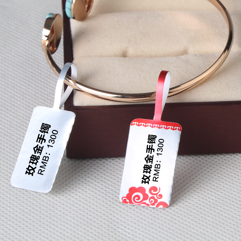 Picture of Silver jewelry price standard bright white jewelry label tag ring glasses label sticker sticker spot