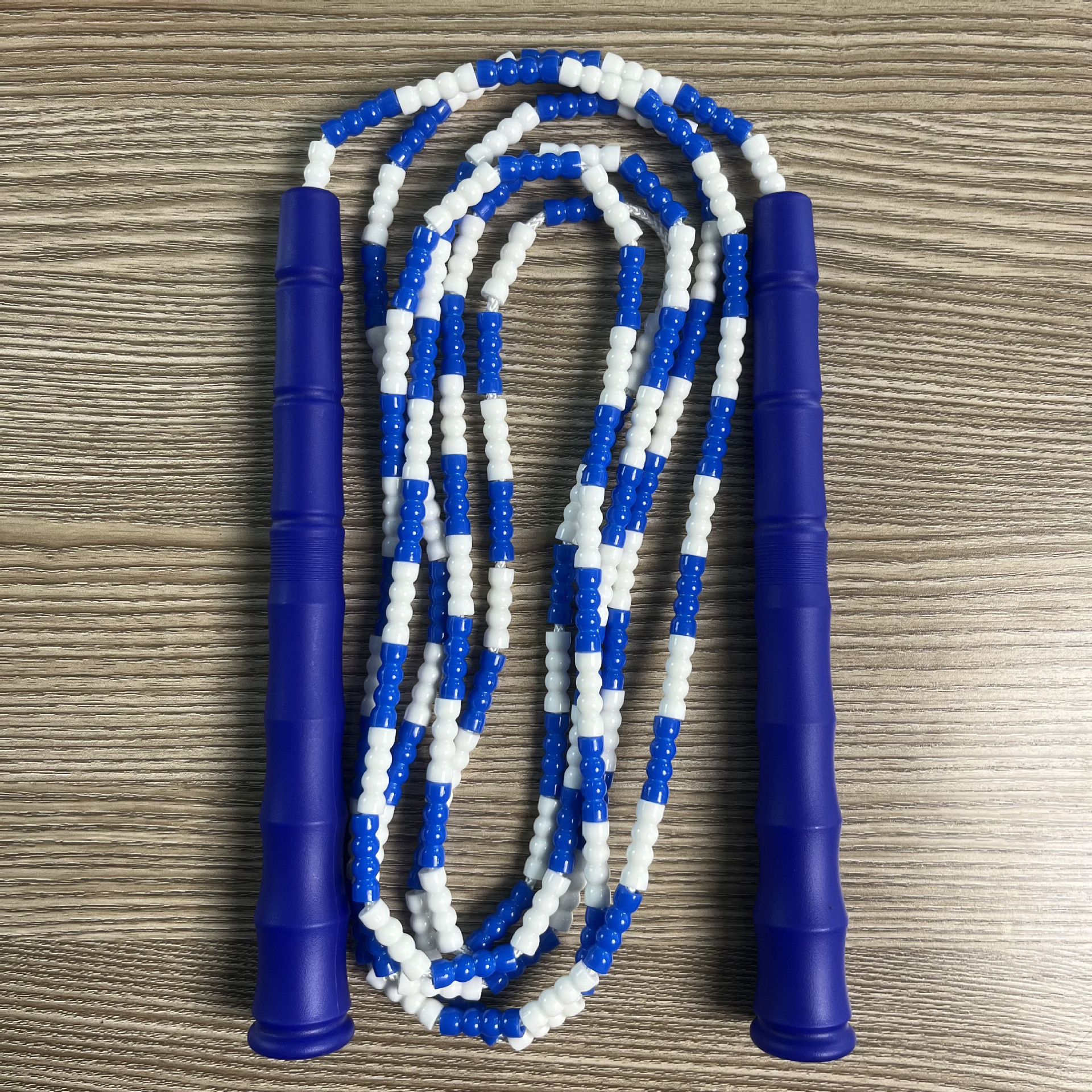 Picture of Manufacturer Wholesale Children's Fitness Sports Pattern Skipping Rope Kindergarten Competition Soft Bead Bamboo Skipping Rope for Primary School Students