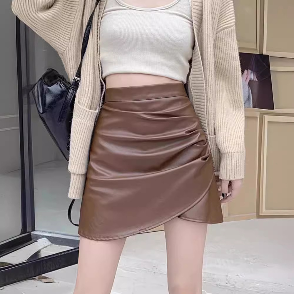 Irregular pu leather skirt women's 2025 autumn and winter new high waist black hip anti-slip A- line short skirt