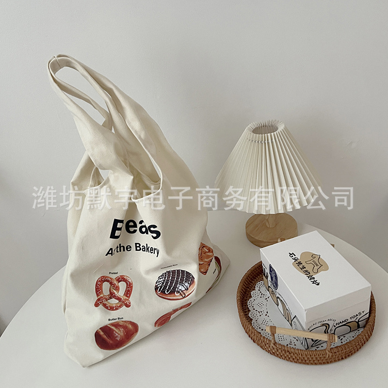 Picture of Bufan Liangpin/[plagiarism stop] bread illustration canvas bag women's shoulder horn bag large capacity shopping bag