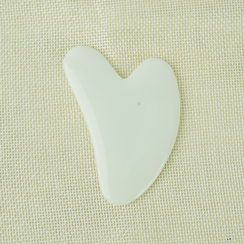 Picture of Manufacturer's Wholesale Resin Heart-Shaped Gua Sha Tools for Massaging the Back, Neck, Waist, and Full Body Meridians, Made of Natural Materials