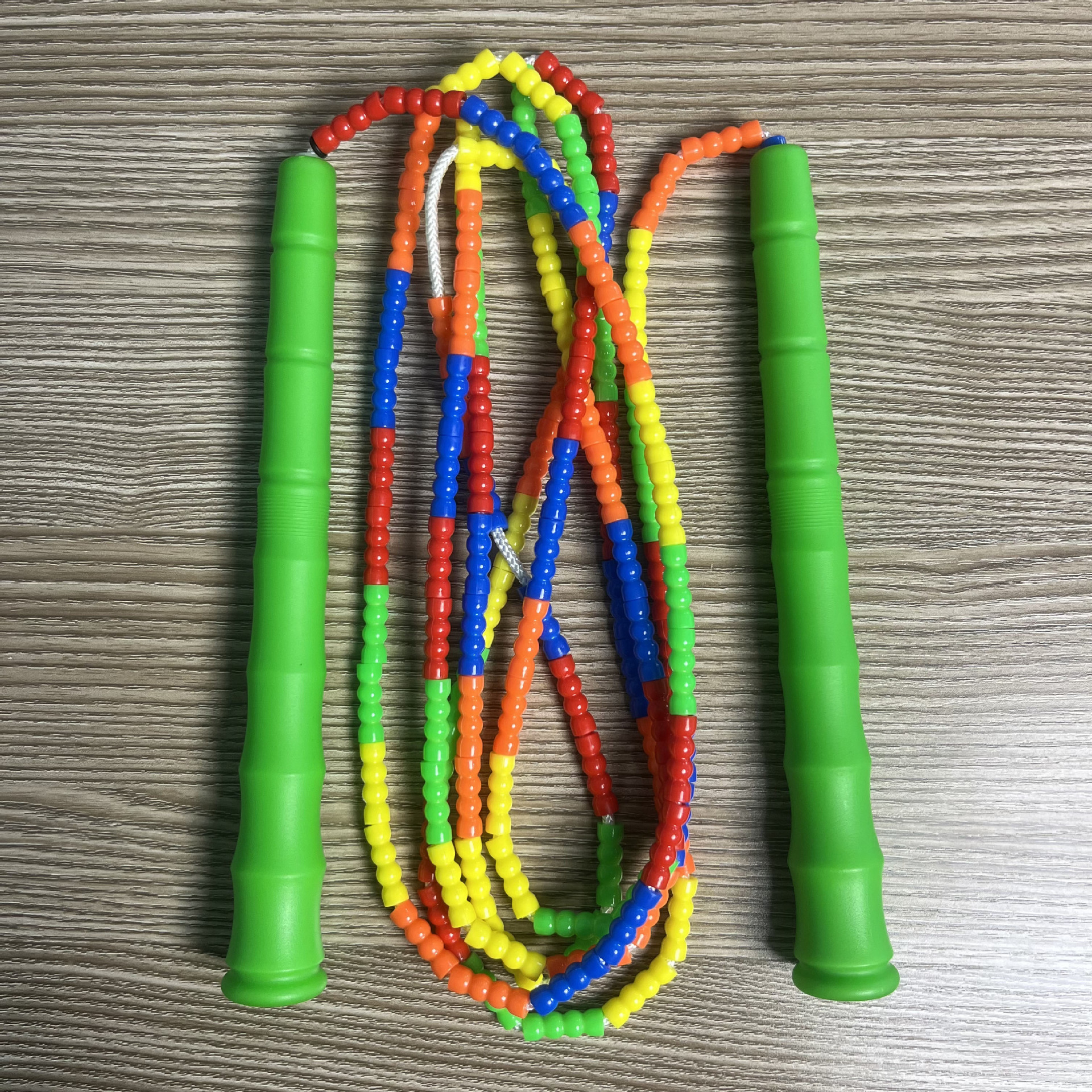 Picture of Manufacturer Wholesale Children's Fitness Sports Pattern Skipping Rope Kindergarten Competition Soft Bead Bamboo Skipping Rope for Primary School Students