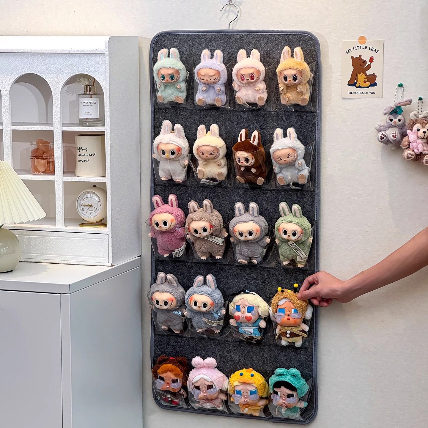 Cross-border multi-functional wall-mounted cloth doll storage hanging bag millet doll pendant cabinet doll storage artifact