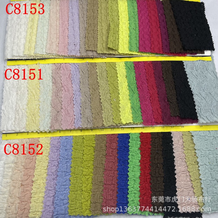 In stock supply knitted polyester cotton wrinkle cloth Jacquard knitted CVC wrinkle cloth jacquard casual clothing swimsuit material