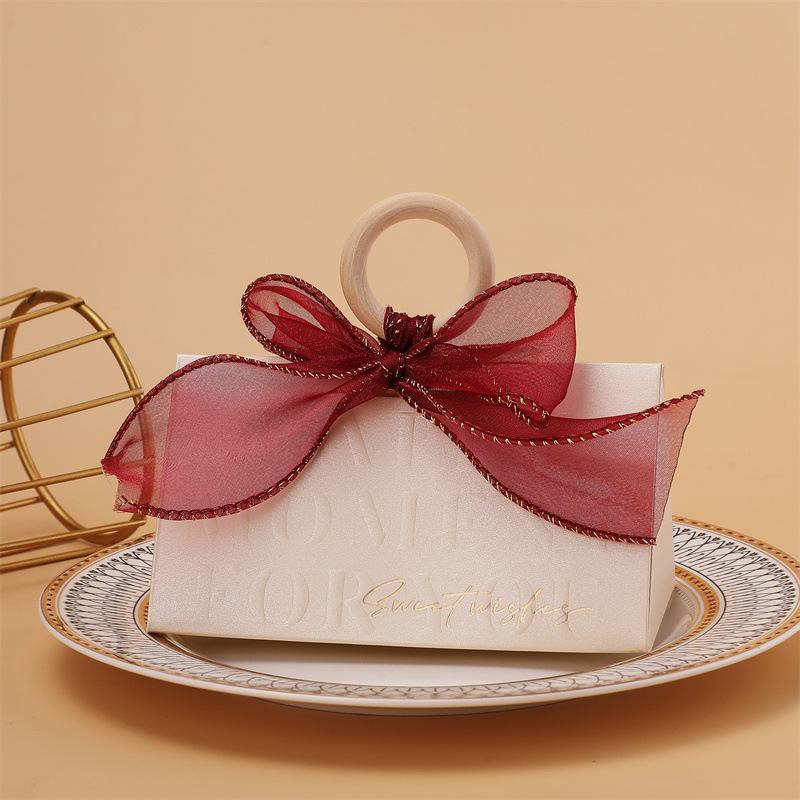Picture of Light luxury champagne hand-held triangle wedding candy box wooden ring hand gift box wedding candy box wholesale