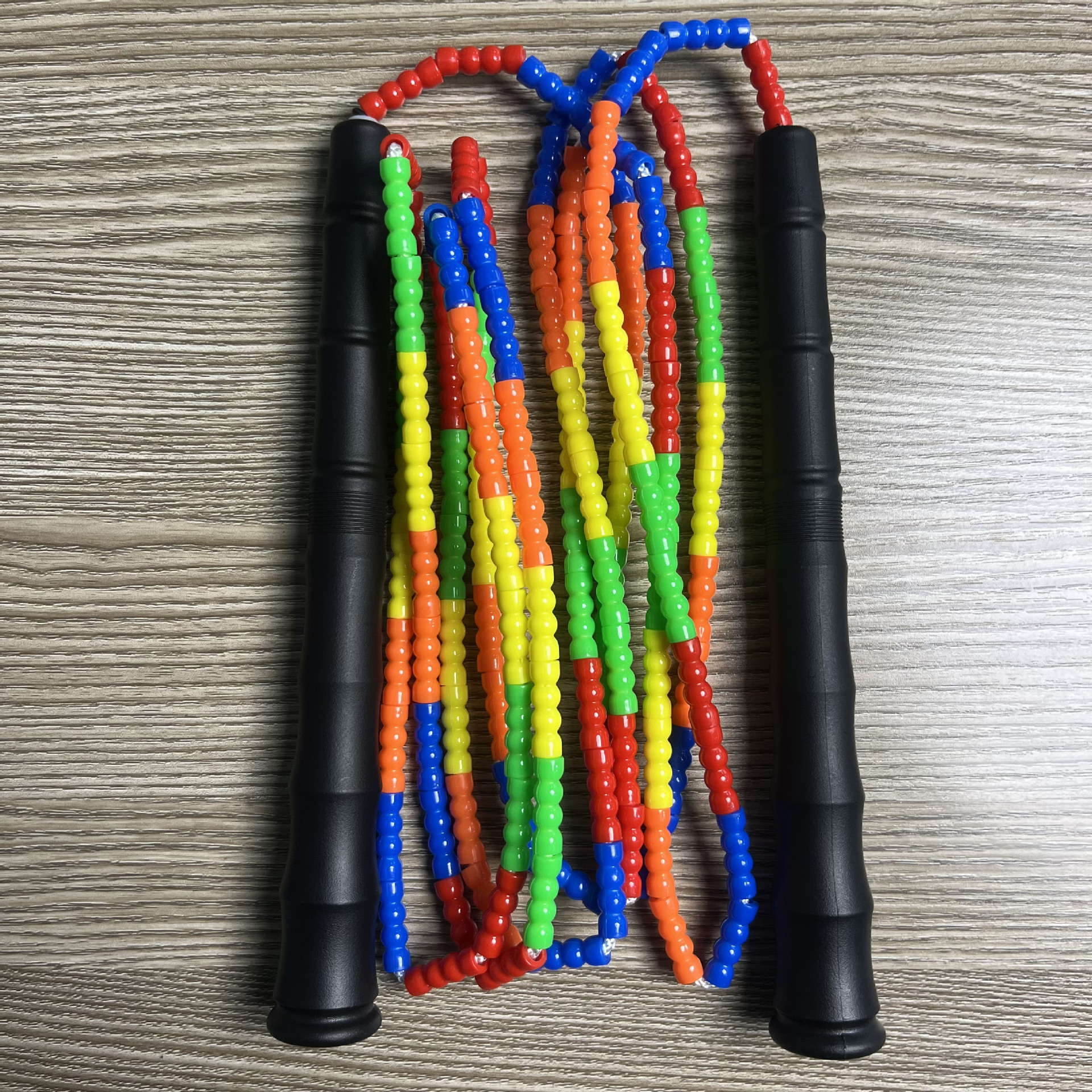 Picture of Manufacturer Wholesale Children's Fitness Sports Pattern Skipping Rope Kindergarten Competition Soft Bead Bamboo Skipping Rope for Primary School Students
