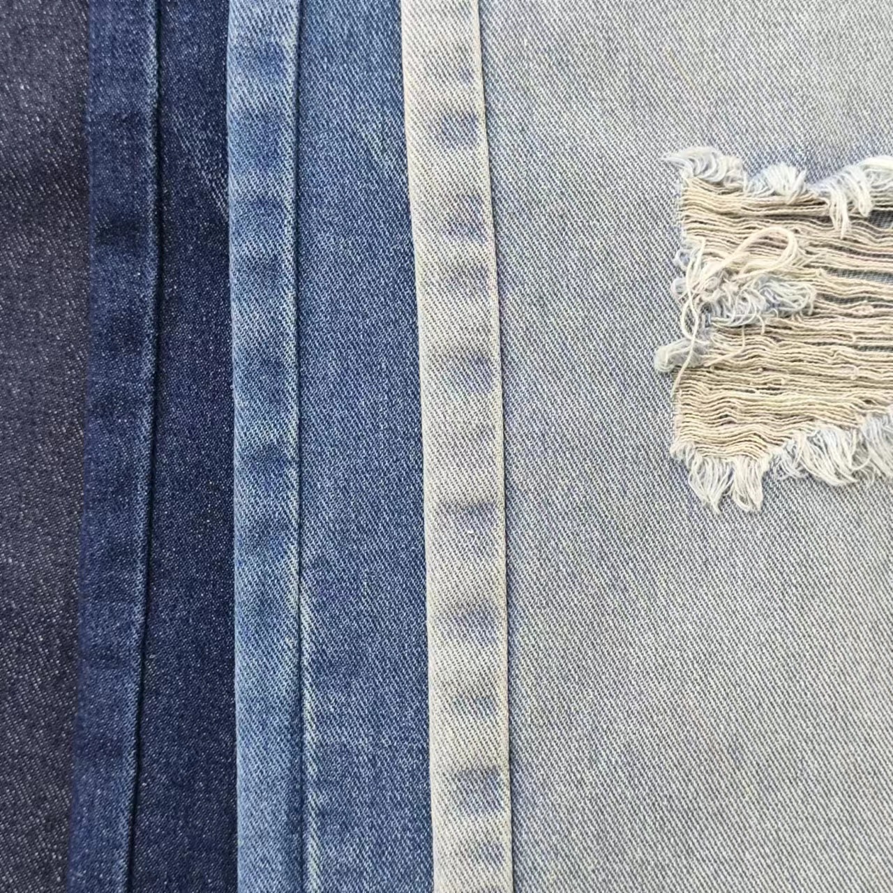 12 An polyester cotton thickened denim 7*7 left oblique non-elastic Denim fabric pants coat autumn and winter fabric 84555