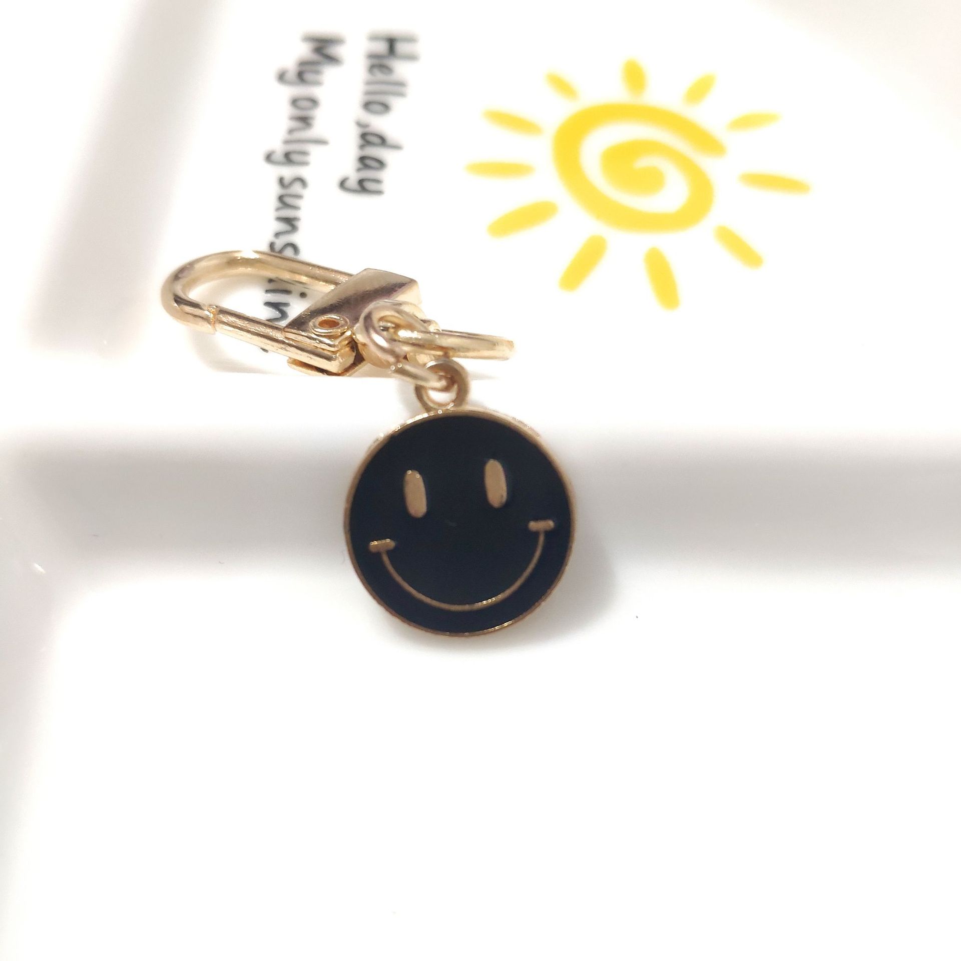Picture of Cross-border e-commerce alloy color dripping smiley face keychain electroplated gold irregular expression bag pendant accessories
