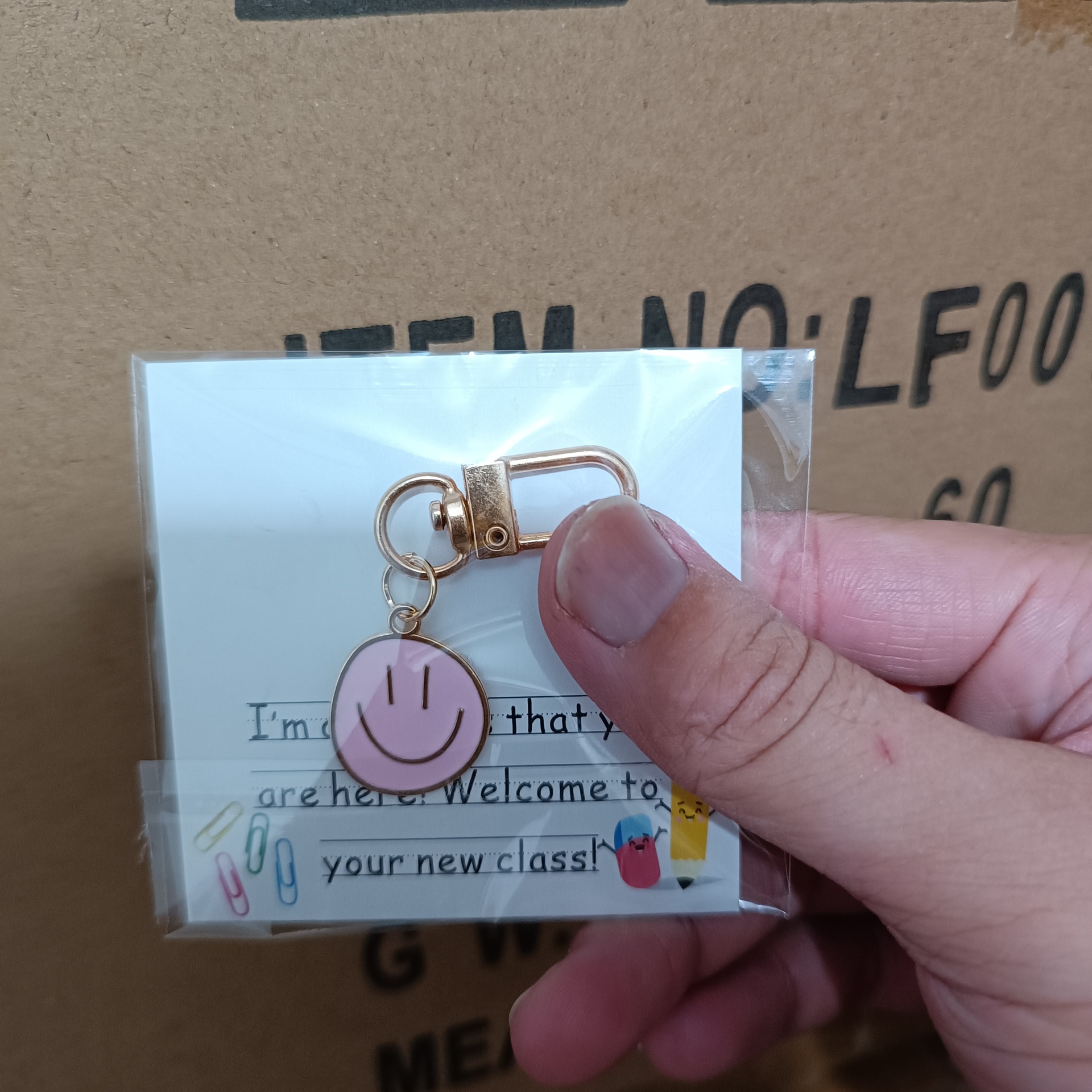 Picture of Cross-border e-commerce alloy color dripping smiley face keychain electroplated gold irregular expression bag pendant accessories