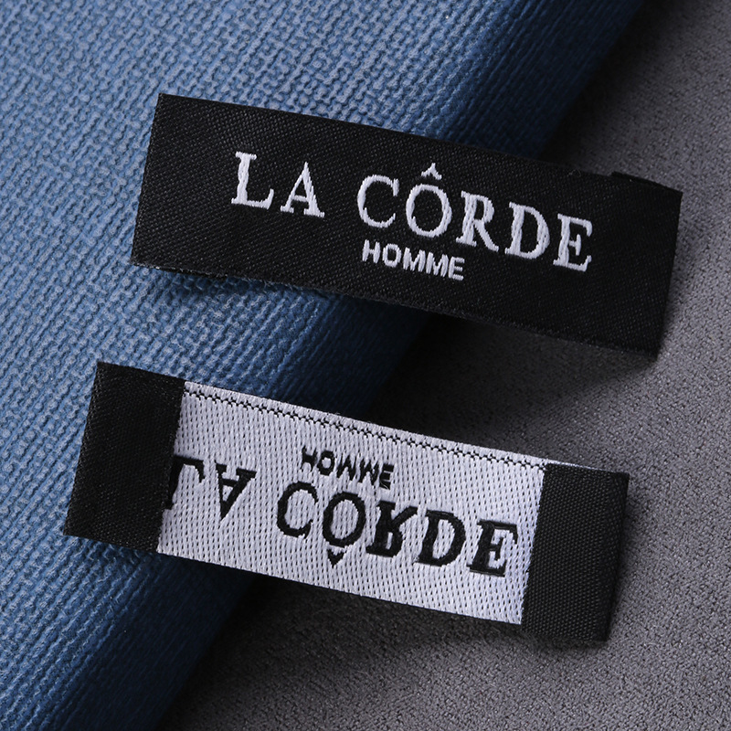 Picture of Manufacturers supply all kinds of woven marks, collar marks, clothing accessories, trademarks, logo woven marks, folded letters, sizes, washed marks