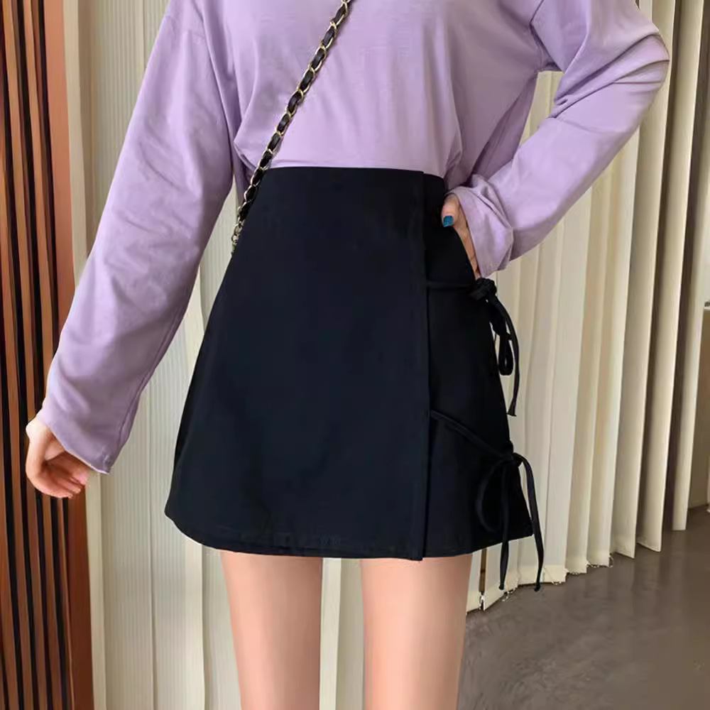 Autumn and summer 2024 new black design sense hip skirt irregular slim high waist A- shaped skirt women