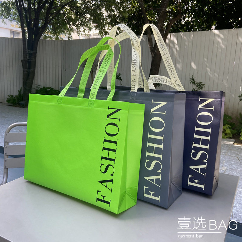 Shoulder coated waterproof non-woven gift long portable packaging bag clothes women's clothing store shopping bag printing