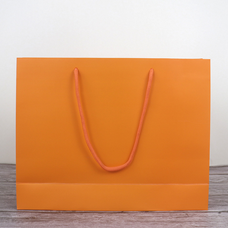 Clothes shop shopping paper bag Kraft paper gift bag fashion big brand handbag Orange women's packaging bag wholesale