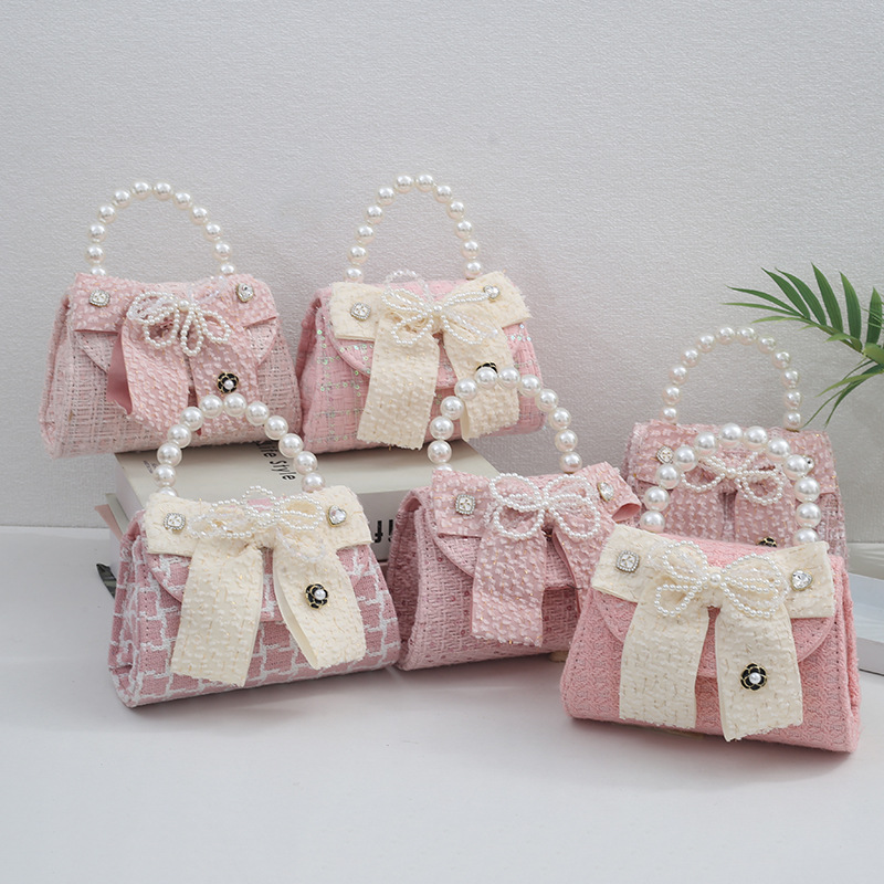 Cross-border 2024 new children's bag girls pearl handle messenger bag kindergarten school storage bag wholesale