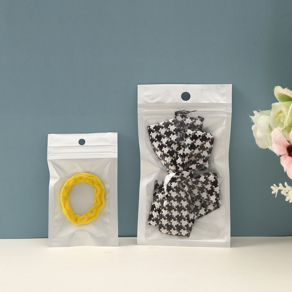 Picture of in stock yin and yang bone bag plastic packaging bag pearl film plus CPP/OPP transparent white bag pearl film self-sealing bag