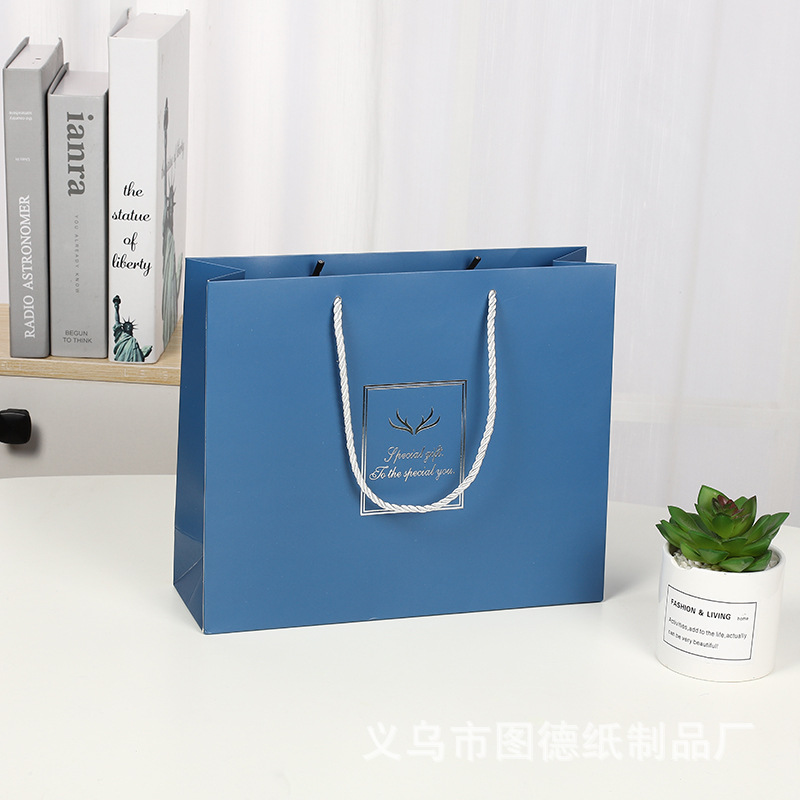 Creative Thickened White Card Gift Bag Blue Handbag Business Packaging Bag Garment Bag Shopping Paper Bag Hand Gift Bag
