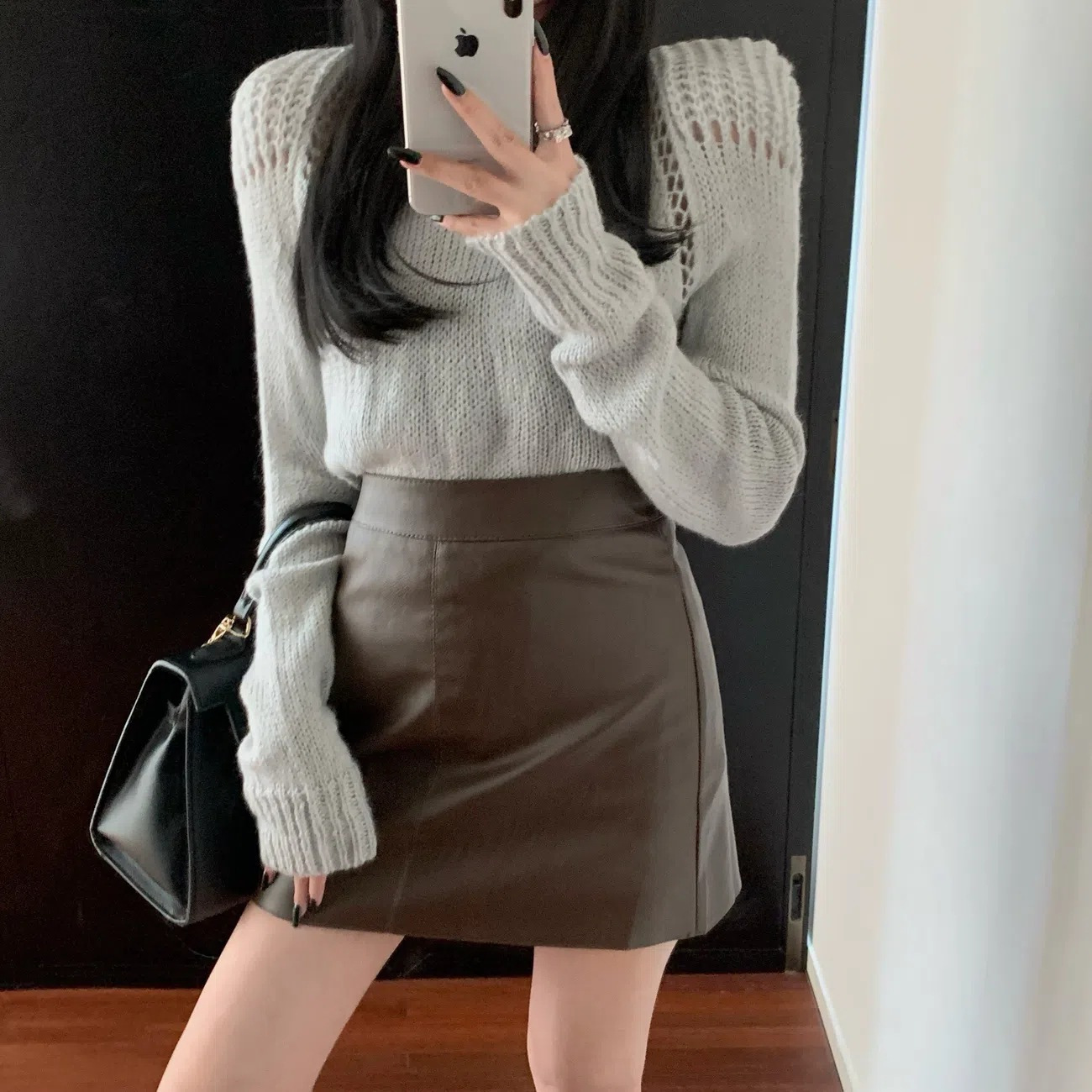 2023 Autumn and Winter Black PU Leather Skirt Skirt Women's New Anti-walking Short Skirt High Waist Hip Covering A- line Hip Skirt