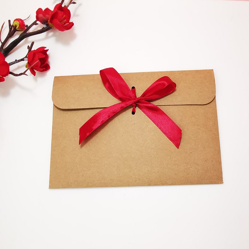 Picture of European envelope Kraft paper style vintage greeting card blessing card packaging bag creative bow CD bag wholesale