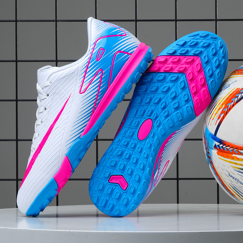 Cross-border foreign trade football shoes men's broken nails primary school students teenagers mandarin duck couple artificial grass spikes training wholesale