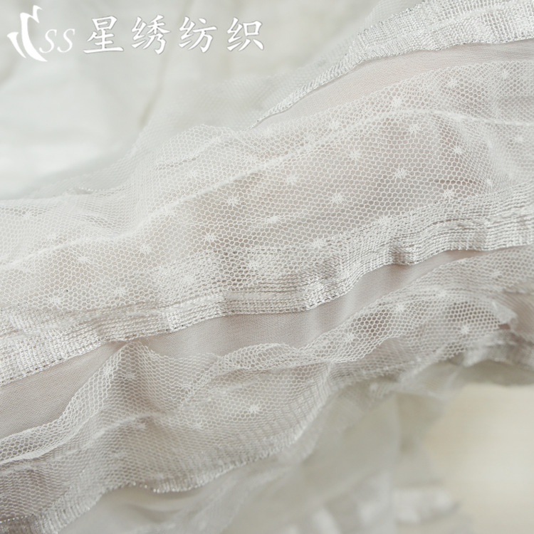Hot selling Pearl chiffon embroidery fabric dot mesh three-dimensional hook embroidery beef Louver skirt dress sleeve fabric