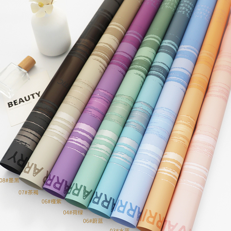 Roland loves to wrap flowers in sunset flower wrapping paper diy handmade flower shop floral materials wholesale