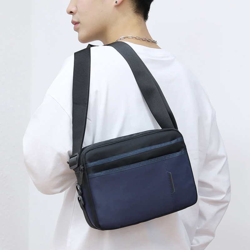 Picture of 2025 New Fashion Contrast Color Shoulder Bag Men's Oxford Cloth Messenger Bag Horizontal Business Casual Bag Travel Backpack Trendy