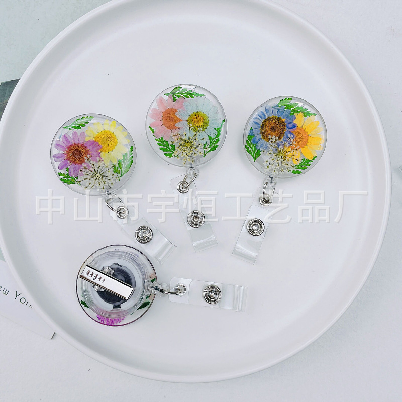 Picture of 2022 Cross-border Dried Flower Easy Pull Button Real Flower Transparent 360-degree Easy Pull Doctor Nurse Scroll Badge