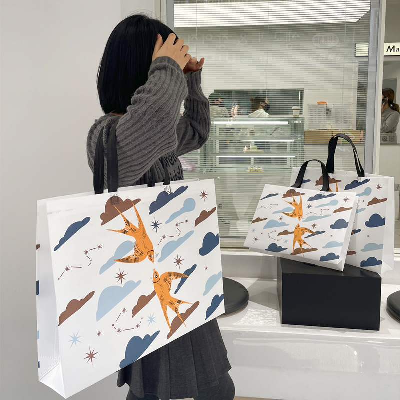 Fashion non-woven handbag clothing store shopping gift thickened large women's clothing bag printed logo