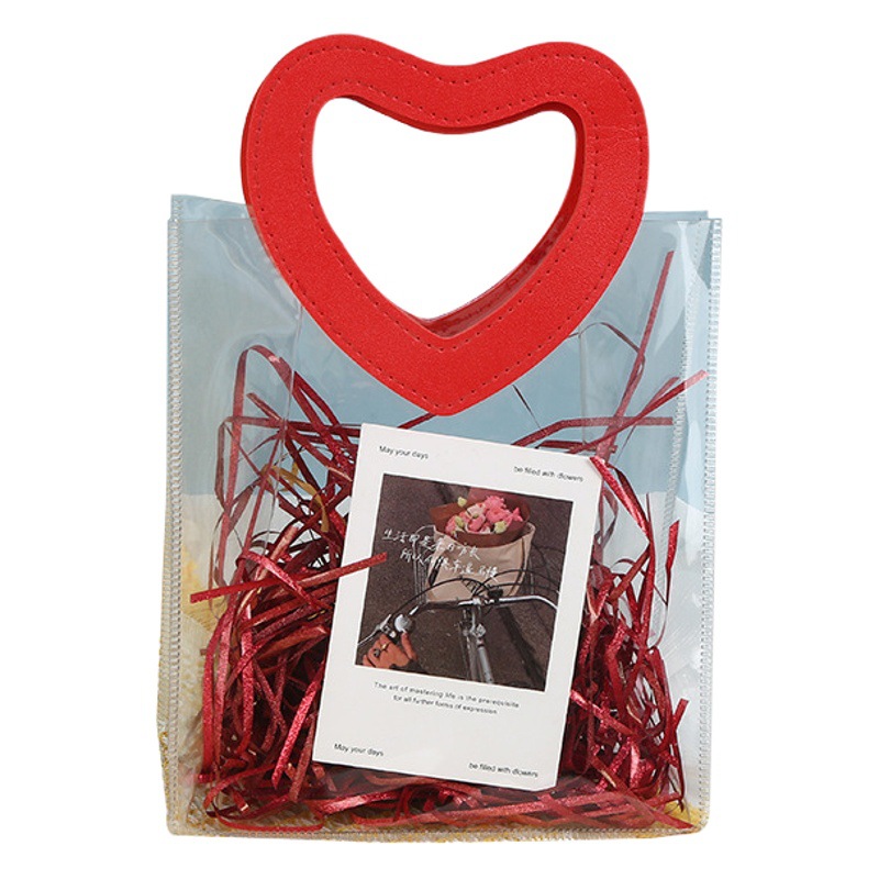 In stock hand gift bag transparent gift bag pvc handbag wholesale heart-shaped gift candy plastic packaging bag ins