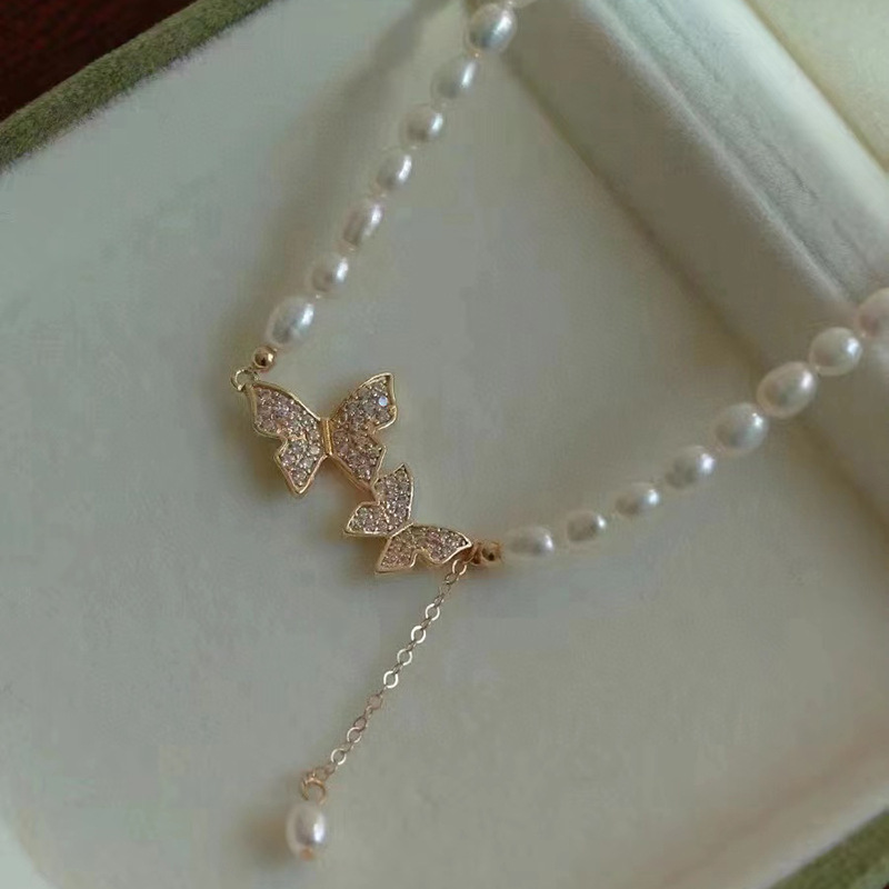 Picture of Zhuji freshwater pearl necklace necklace 5-6mm rice beads butterfly pendant 38 5cm length female clavicle chain wholesale