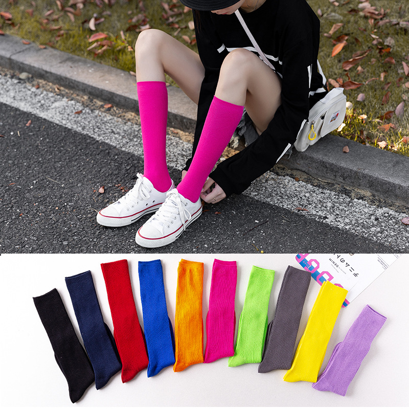 Autumn new solid color calf socks women fluorescent color tide socks Japanese knee socks cotton socks piled socks women wholesale