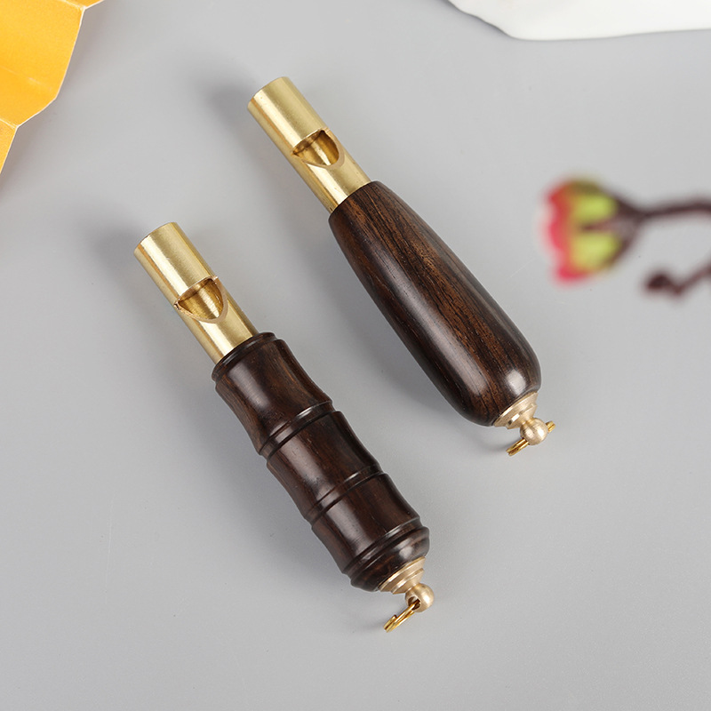 Picture of Brass Red Sandalwood Outdoor Lifesaving Whistle Keychain Pendant Competition Tall Whistle Mountaineering Training Pendant