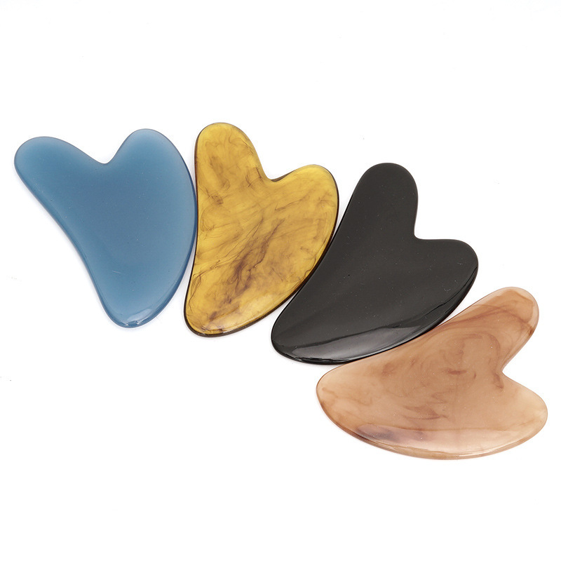 Picture of Manufacturer's Wholesale Resin Heart-Shaped Gua Sha Tools for Massaging the Back, Neck, Waist, and Full Body Meridians, Made of Natural Materials