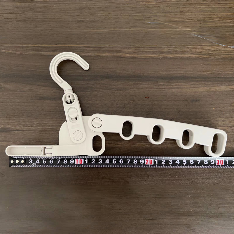 Picture of Folding clothes hanger thickened indoor multi-functional wall hanging travel plastic hanger wholesale business trip portable five-hole hanger