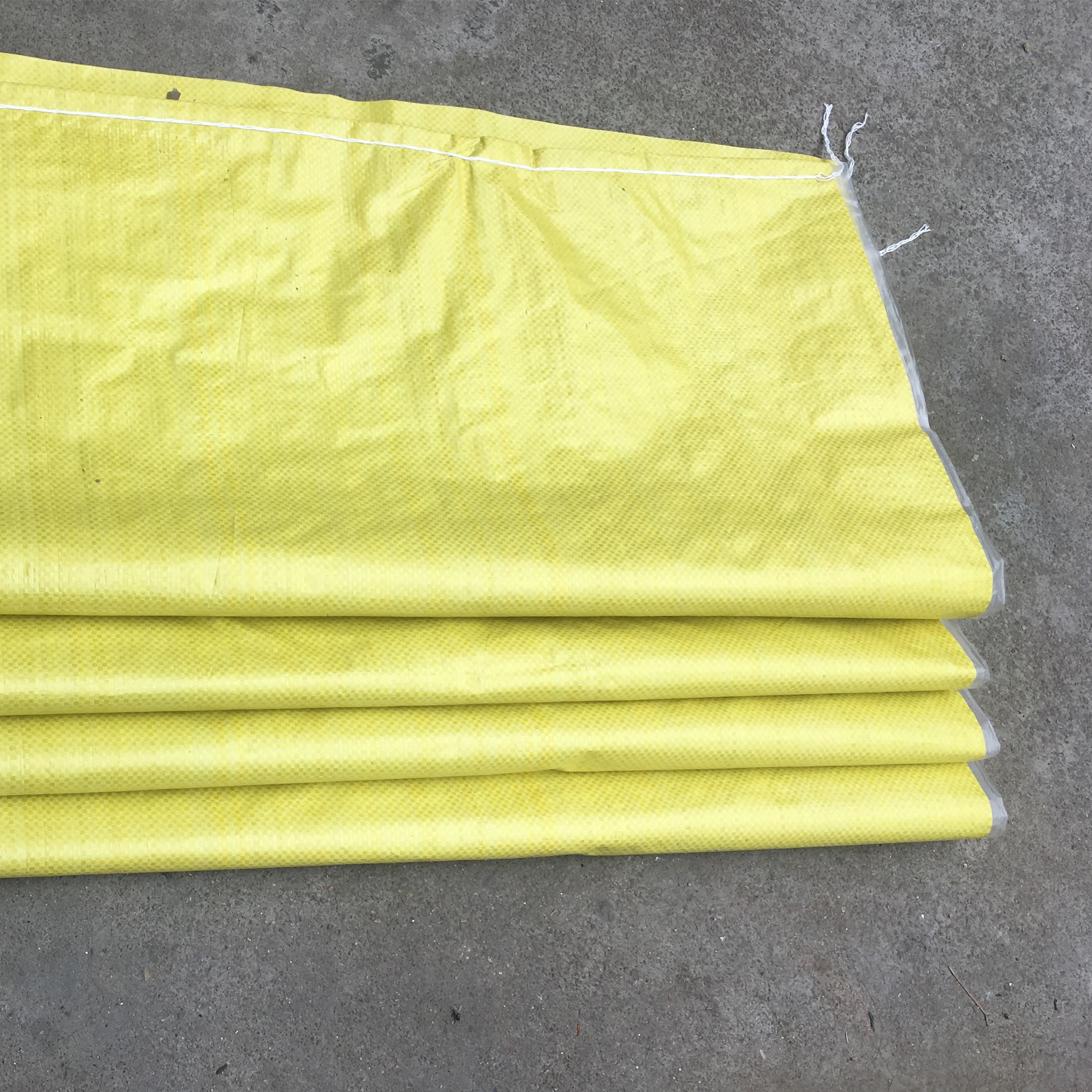 Thickened bright yellow film waterproof woven bag snakeskin bag plastic logistics bag packing bag 65*85