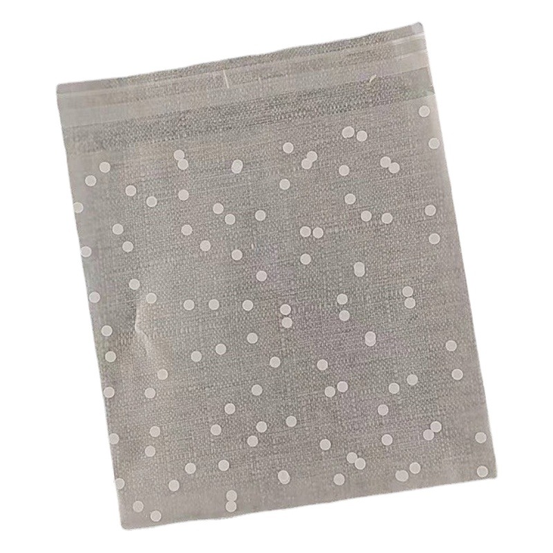 Factory direct supply thick compound frosted biscuits cranberry handmade snacks white polka dot self-adhesive bag 100/piece