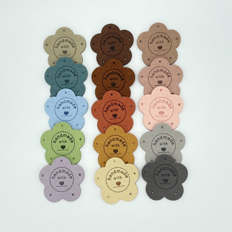 Spot color label handmade petal five-hole embossed suede leather label hat handmade bag children's clothing
